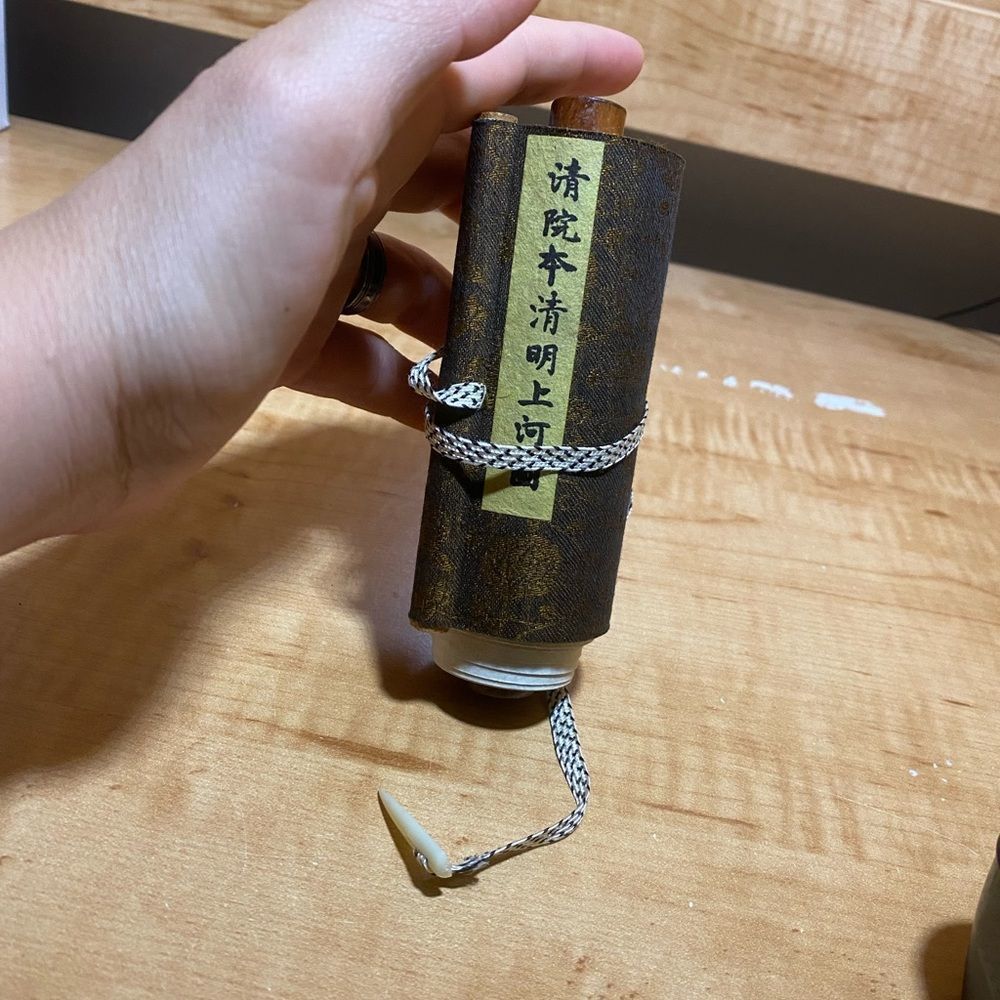 Elegant Brown Scroll With Intricate Design - image 1